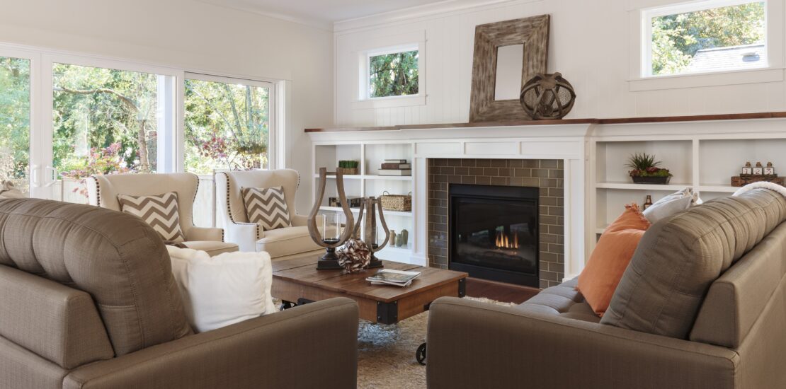 living room with sofas and fireplace